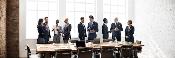 Grop of business professionals gathered around a conference table