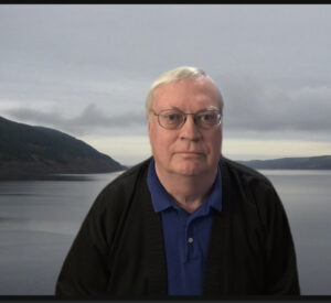 Image of Mikael Blaisdell with a background of Loch Ness